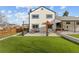 Backyard with artificial turf, patio area, and a wooden fence, perfect for outdoor activities and relaxation at 16402 E Tennessee Ave, Aurora, CO 80017