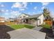 Lush backyard featuring an outdoor patio with furniture, manicured lawn, and a fenced perimeter for privacy at 16402 E Tennessee Ave, Aurora, CO 80017