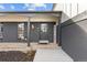 Charming entryway with painted brick, decorative lanterns, and a welcoming welcome sign at 16402 E Tennessee Ave, Aurora, CO 80017