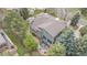 Aerial view of the property featuring a backyard patio, mature trees and the surrounding neighborhood at 5442 S Dayton Ct, Greenwood Village, CO 80111