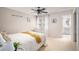 Bright bedroom with white walls, a ceiling fan, and white curtains at 5442 S Dayton Ct, Greenwood Village, CO 80111
