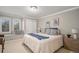Well-lit bedroom featuring a built-in window seat, plush pillows, and a comfortable bed at 5442 S Dayton Ct, Greenwood Village, CO 80111