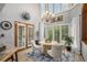 Bright breakfast nook with large windows, a chandelier, and a round table perfect for casual dining at 5442 S Dayton Ct, Greenwood Village, CO 80111