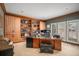 Inviting office with custom built-in shelving, large windows, and detailed wood trim throughout at 5442 S Dayton Ct, Greenwood Village, CO 80111