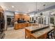 Spacious kitchen with wood cabinets, a large island, stainless steel appliances, and modern finishes at 5442 S Dayton Ct, Greenwood Village, CO 80111