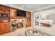 A living room with a fireplace, built-in shelving, and access to the bedroom at 5442 S Dayton Ct, Greenwood Village, CO 80111