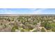 Beautiful neighborhood with mature trees and views of the nearby landscape in an aerial image at 5442 S Dayton Ct, Greenwood Village, CO 80111