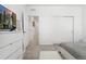 Bright bedroom with a soft bed, gray accent wall, and an open closet design at 12314 Hayloft Ln, Thornton, CO 80241