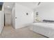 Bright bedroom with carpet featuring white walls, ceiling fan, and natural light at 12314 Hayloft Ln, Thornton, CO 80241
