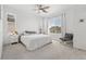 Bright bedroom featuring neutral tones, carpet, ceiling fan, and natural light at 12314 Hayloft Ln, Thornton, CO 80241