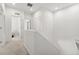 Upstairs hallway with carpet and white walls leading to bedrooms and other living spaces at 12314 Hayloft Ln, Thornton, CO 80241