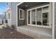 Back patio features sliding glass doors and low maintenance landscaping at 12314 Hayloft Ln, Thornton, CO 80241