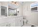 Double vanity bathroom with modern fixtures and a frameless shower at 9573 Castle Ridge Cir, Highlands Ranch, CO 80129