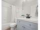 Clean bathroom, featuring a light-grey vanity and a shower/tub combo at 9573 Castle Ridge Cir, Highlands Ranch, CO 80129