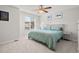 Spacious bedroom with light walls, ceiling fan, and plush bedding at 9573 Castle Ridge Cir, Highlands Ranch, CO 80129