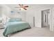 Bright bedroom with ceiling fan and view into hallway at 9573 Castle Ridge Cir, Highlands Ranch, CO 80129