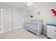 Spacious bedroom with double closets and a crib at 9573 Castle Ridge Cir, Highlands Ranch, CO 80129