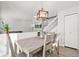 Dining area with light wood table and chairs at 9573 Castle Ridge Cir, Highlands Ranch, CO 80129