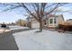 Two-story house with attached garage, viewed from the street at 9573 Castle Ridge Cir, Highlands Ranch, CO 80129