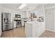 Modern kitchen with island and stainless steel appliances at 9573 Castle Ridge Cir, Highlands Ranch, CO 80129