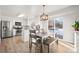 Bright kitchen with stainless steel appliances and white cabinets at 9573 Castle Ridge Cir, Highlands Ranch, CO 80129