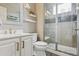 Bathroom with glass enclosed shower, vanity with stylish mirror and modern fixtures at 8406 Winter Berry Dr, Castle Pines, CO 80108
