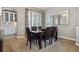 Dining room with dark wood table, chairs, and a large decorative mirror at 8406 Winter Berry Dr, Castle Pines, CO 80108