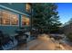 Home exterior with a cozy patio area, perfect for outdoor entertaining and enjoying the serene backyard at 8406 Winter Berry Dr, Castle Pines, CO 80108