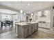 Spacious kitchen features a large island, pendant lighting, and modern appliances at 8406 Winter Berry Dr, Castle Pines, CO 80108