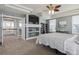 Spacious main bedroom featuring coffered ceilings, a ceiling fan, and built-in shelving at 8406 Winter Berry Dr, Castle Pines, CO 80108