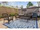 Inviting patio area with wicker furniture set on a blue patterned rug, great for outdoor relaxing at 8406 Winter Berry Dr, Castle Pines, CO 80108