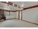 A finished basement area with faux fireplace and carpet and room for entertaining at 784 W Sterne Pkwy, Littleton, CO 80120