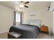 A comfortable bedroom with neutral walls features a ceiling fan and a large bed at 784 W Sterne Pkwy, Littleton, CO 80120