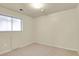 This bedroom has carpet flooring, window, and neutral paint, with space for furniture at 784 W Sterne Pkwy, Littleton, CO 80120