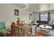 Cozy living area with a rustic dining set, comfortable seating, and stylish decor at 784 W Sterne Pkwy, Littleton, CO 80120