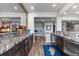 Finished basement bar area boasts granite countertops and modern stainless steel appliances at 15295 E Cherry Creek S Rd, Larkspur, CO 80118