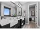Contemporary bathroom features double sinks, modern fixtures, and natural light at 15295 E Cherry Creek S Rd, Larkspur, CO 80118