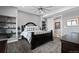 Bright bedroom with a black accent bed frame and a decorative shelf at 15295 E Cherry Creek S Rd, Larkspur, CO 80118