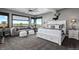 Cozy bedroom with scenic views, a seating area, and a luxurious king-size bed at 15295 E Cherry Creek S Rd, Larkspur, CO 80118
