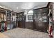 Large walk-in closet provides ample storage with custom shelving and cabinets at 15295 E Cherry Creek S Rd, Larkspur, CO 80118