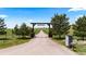 Long private driveway leading to a ranch-style home with well-maintained landscaping at 15295 E Cherry Creek S Rd, Larkspur, CO 80118