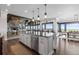 Elegant kitchen featuring a large island, stainless steel appliances, and an open layout at 15295 E Cherry Creek S Rd, Larkspur, CO 80118