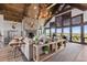 Inviting living room with a fireplace, high ceiling, and an abundance of natural light and scenic views at 15295 E Cherry Creek S Rd, Larkspur, CO 80118
