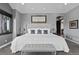 Relaxing main bedroom boasts a king bed, neutral palette, and comfortable seating at 15295 E Cherry Creek S Rd, Larkspur, CO 80118