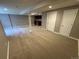 Spacious finished basement features neutral carpet and paint, plus a convenient wet bar at 4746 Raven Run, Broomfield, CO 80023
