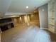 Spacious carpeted basement with wet bar, shelving, and plenty of open area for entertaining at 4746 Raven Run, Broomfield, CO 80023