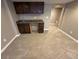 This finished basement has neutral carpet, a wet bar with dark cabinets and granite counters at 4746 Raven Run, Broomfield, CO 80023