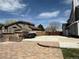 Spacious paved backyard with outdoor kitchen area, trailer parking, and well-maintained fencing at 2050 Lake Circle Dr, Thornton, CO 80241