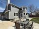 A lovely backyard featuring a well-maintained lawn, a patio area, and a dining set at 2050 Lake Circle Dr, Thornton, CO 80241