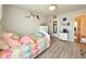 Bright bedroom with a cozy bed, neutral walls, and charming decor creating a relaxing atmosphere at 2050 Lake Circle Dr, Thornton, CO 80241